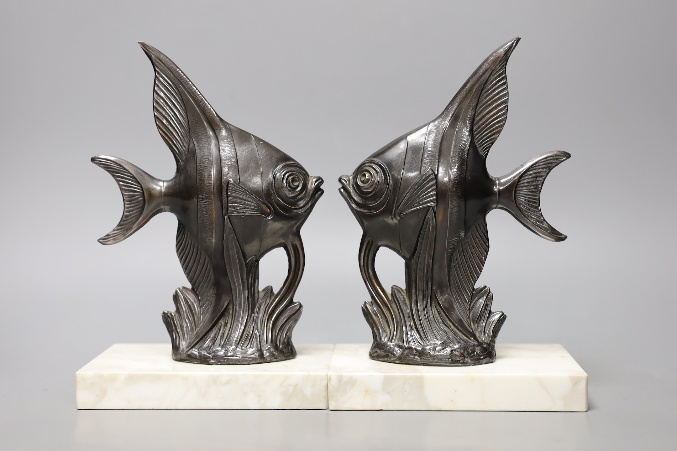 Two pairs of Art Deco spelter 'Angel fish' bookends. Tallest pair 20cm